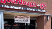 The inviting entrance of Rohnert Park Sourdough & Co. showcasing a menu focused on the best sandwiches, soups, and salads