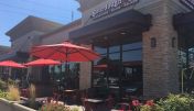 The inviting entrance of Sacramento Howe Avenue Sourdough & Co. showcasing a menu focused on the best sandwiches, soups, and salads