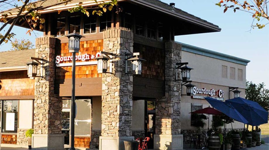 The inviting entrance of Lincoln Lincoln Blvd Sourdough & Co. showcasing a menu focused on the best sandwiches, soups, and salads