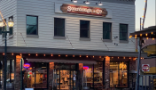 The inviting entrance of Placerville Sourdough & Co. showcasing a menu focused on the best sandwiches, soups, and salads