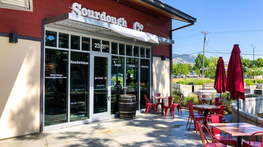 The inviting entrance of Walnut Creek Sourdough & Co. showcasing a menu focused on the best sandwiches, soups, and salads