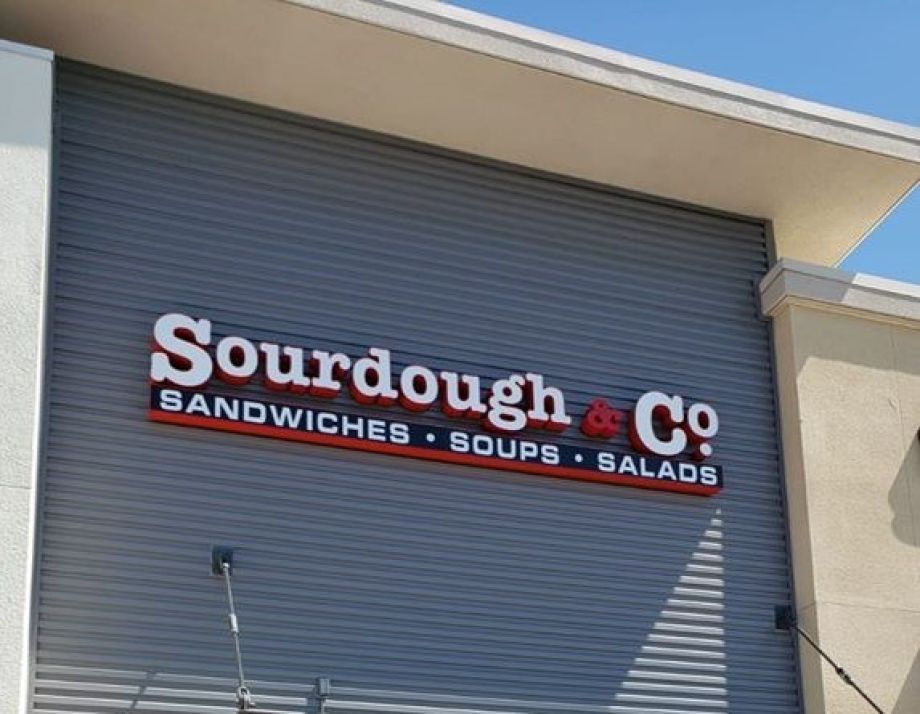 The inviting entrance of Sacramento Delta Shores Circle Sourdough & Co. showcasing a menu focused on the best sandwiches, soups, and salads