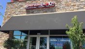 The inviting entrance of Dublin Sourdough & Co. showcasing a menu focused on the best sandwiches, soups, and salads