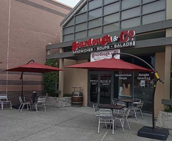 The inviting entrance of Novato Vintage Oaks Sourdough & Co. showcasing a menu focused on the best sandwiches, soups, and salads
