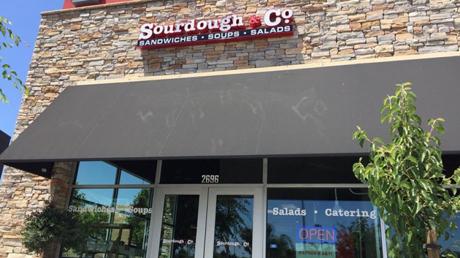 The inviting entrance of Dublin Sourdough & Co. showcasing a menu focused on the best sandwiches, soups, and salads