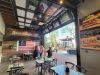 The inviting entrance of Huntington Beach (Inside Bella Tera Mall) Sourdough & Co.) showcasing a menu focused on the best sandwiches, soups, and salads