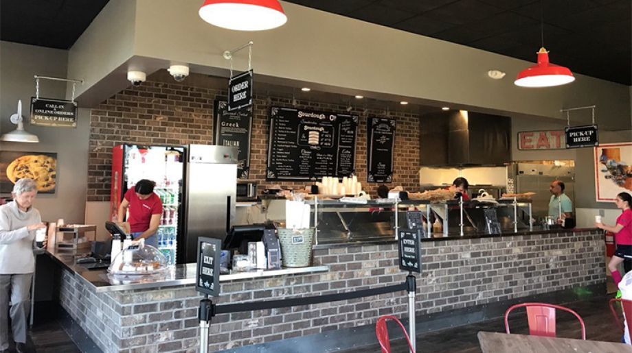 The inviting entrance of Rocklin Sourdough & Co. showcasing a menu focused on the best sandwiches, soups, and salads