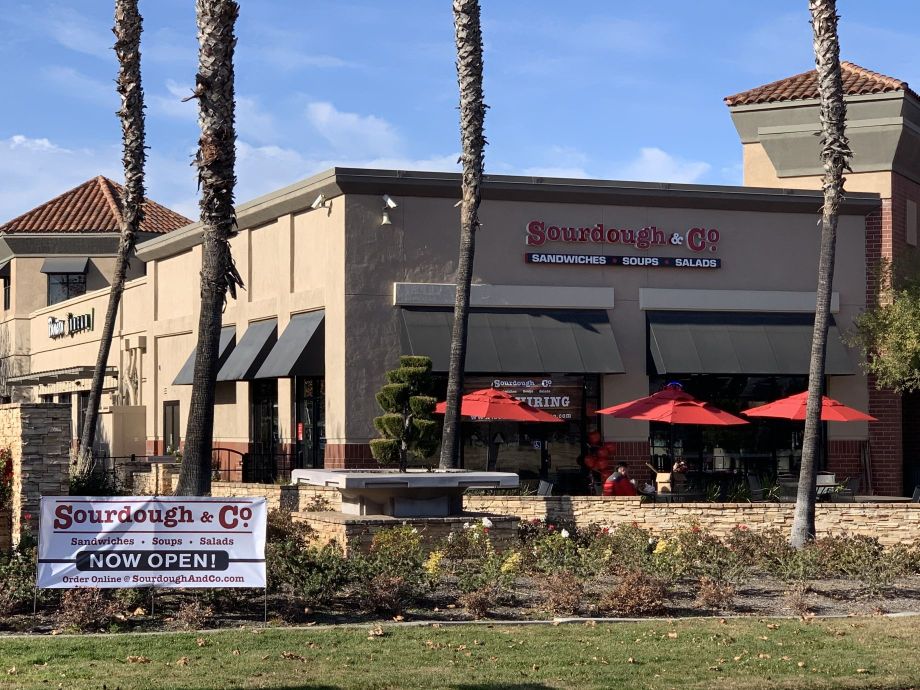 The inviting entrance of Sacramento Del Paso Road Sourdough & Co. showcasing a menu focused on the best sandwiches, soups, and salads