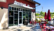 The inviting entrance of Walnut Creek Sourdough & Co. showcasing a menu focused on the best sandwiches, soups, and salads