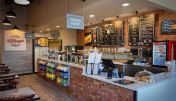 The inviting interior of Avondale Sourdough & Co. showcasing a menu focused on the best sandwiches, soups, and salads