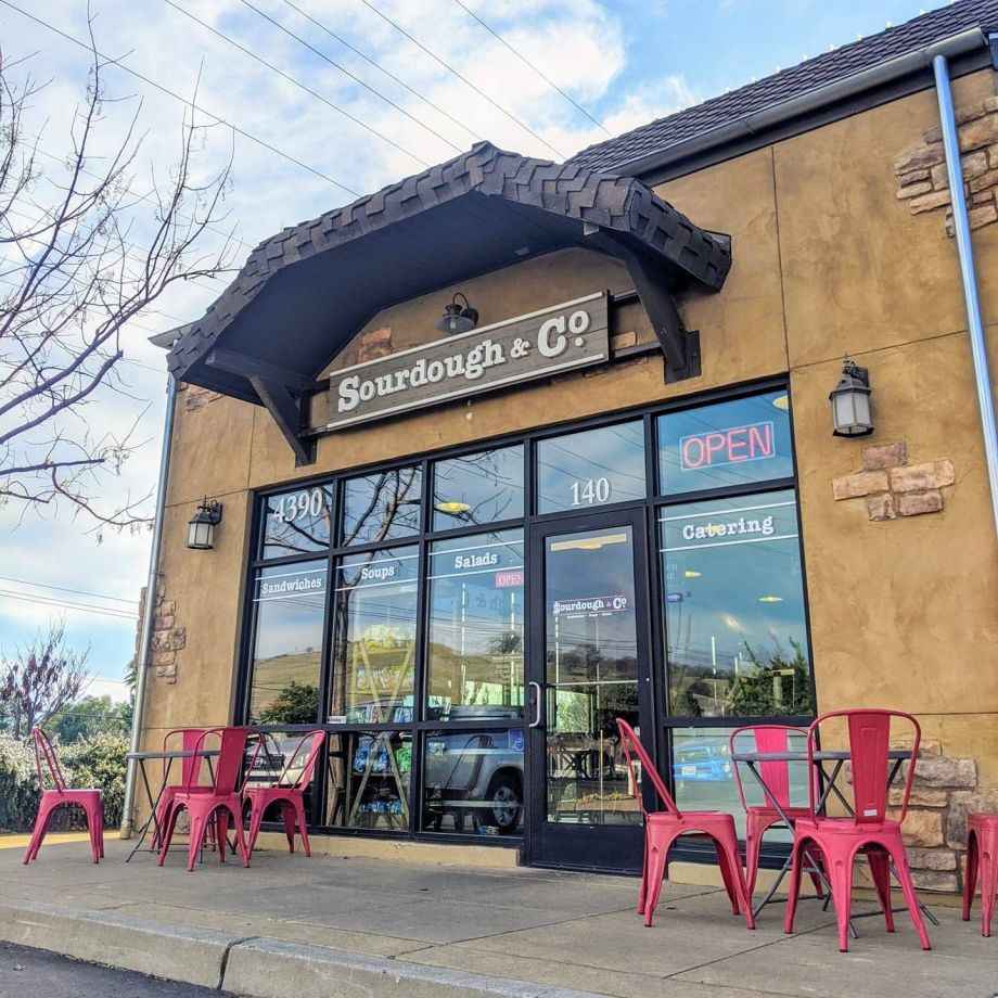 The inviting entrance of El Dorado Hills Town Center Blvd Sourdough & Co. showcasing a menu focused on the best sandwiches, soups, and salads