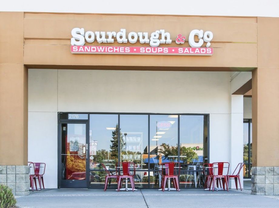 The inviting entrance of Auburn's Sourdough & Co. Store showcasing a menu focused on the best sandwiches, soups, and salads