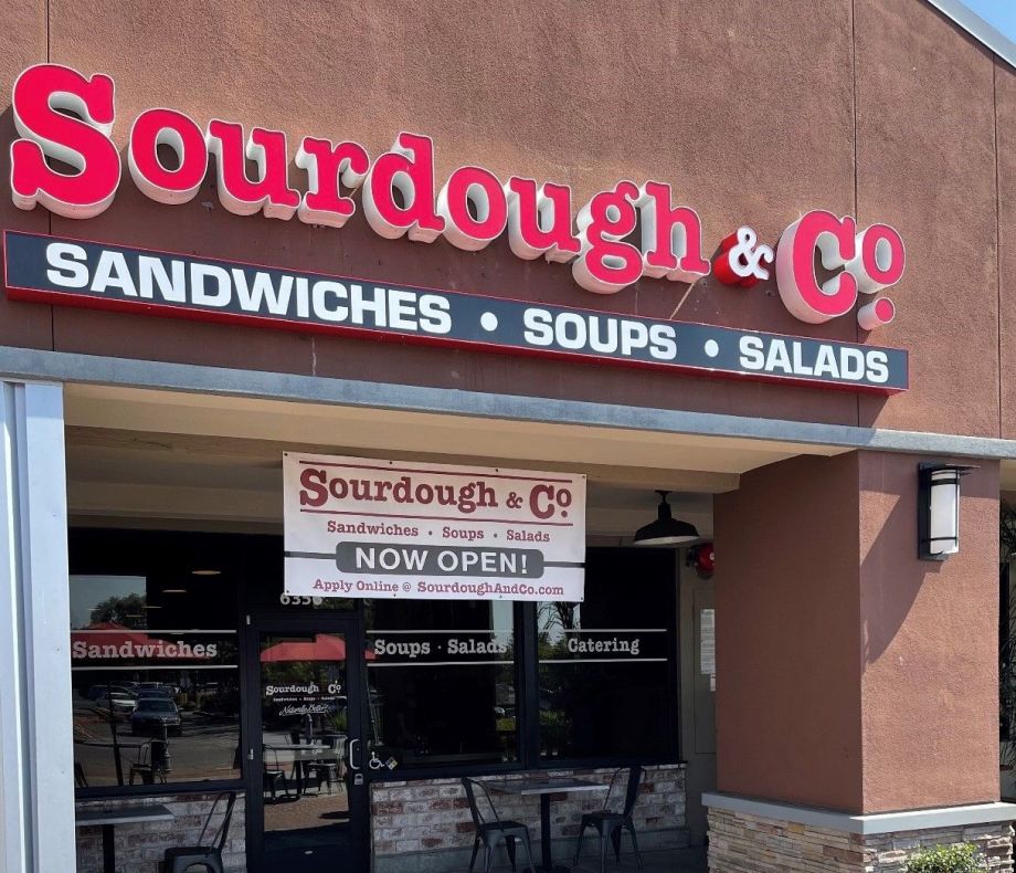 The inviting entrance of Rohnert Park Sourdough & Co. showcasing a menu focused on the best sandwiches, soups, and salads